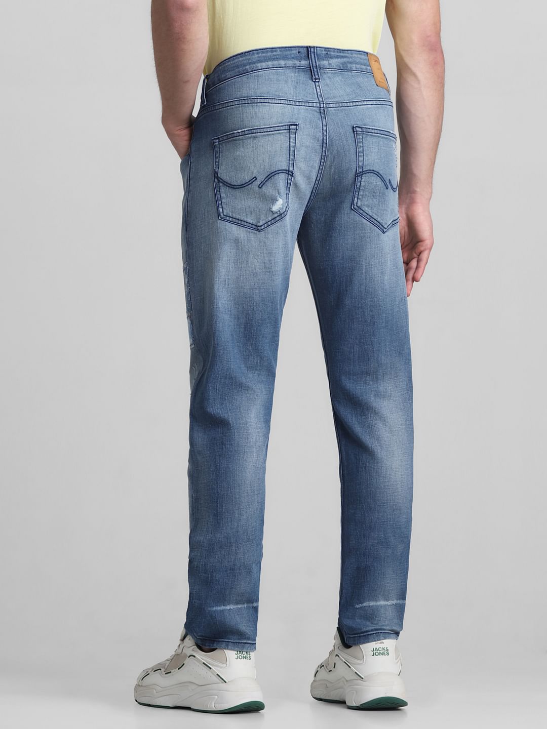 Light Blue Low Rise Distressed Tim Slim Jeans