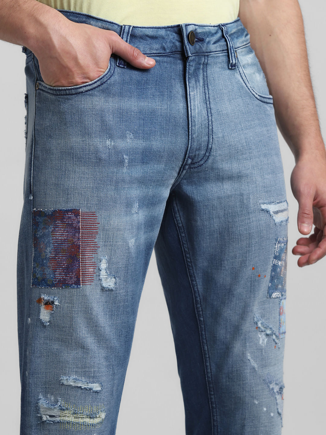 Light Blue Low Rise Distressed Tim Slim Jeans