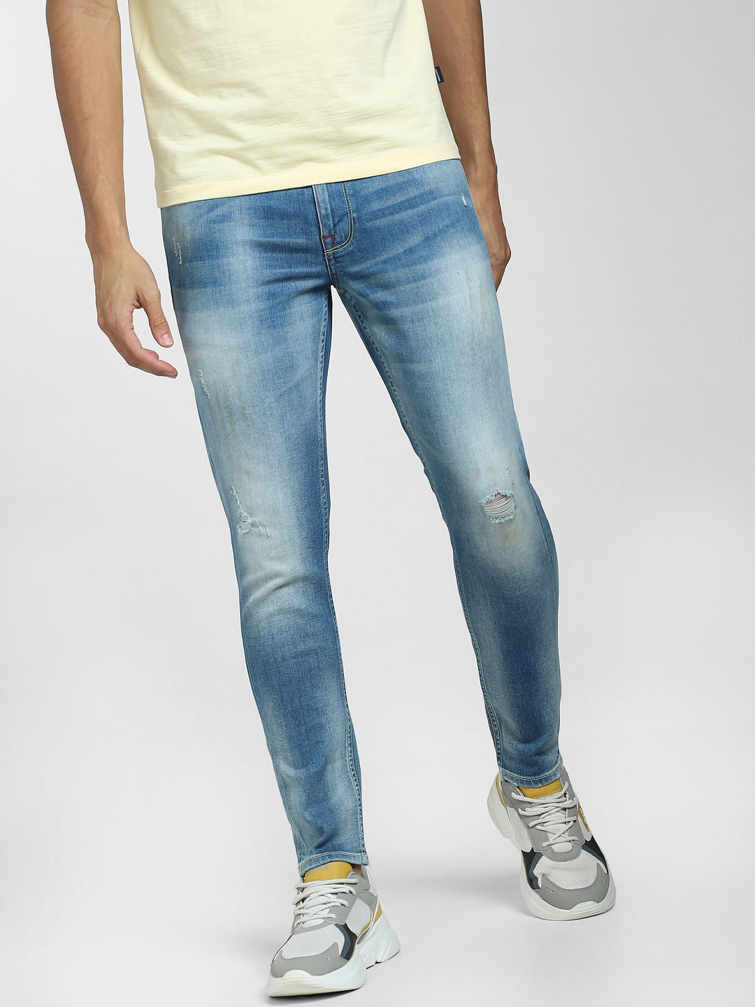 Light Blue Mid Rise Distressed Slim Fit Jeans